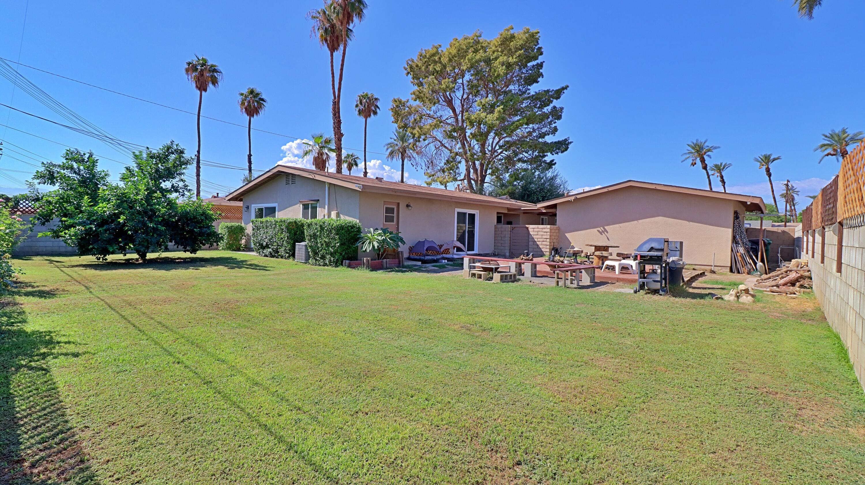 44840 Windsor Drive Indio, CA 92201 - Photo 17 of 26 a front view of a house with garden
