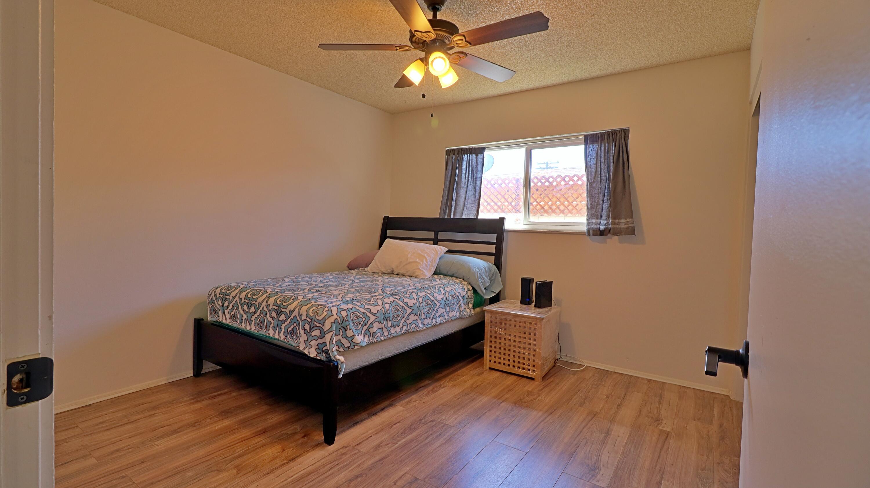 44840 Windsor Drive Indio, CA 92201 - Photo 6 of 26 a bedroom with a bed and window