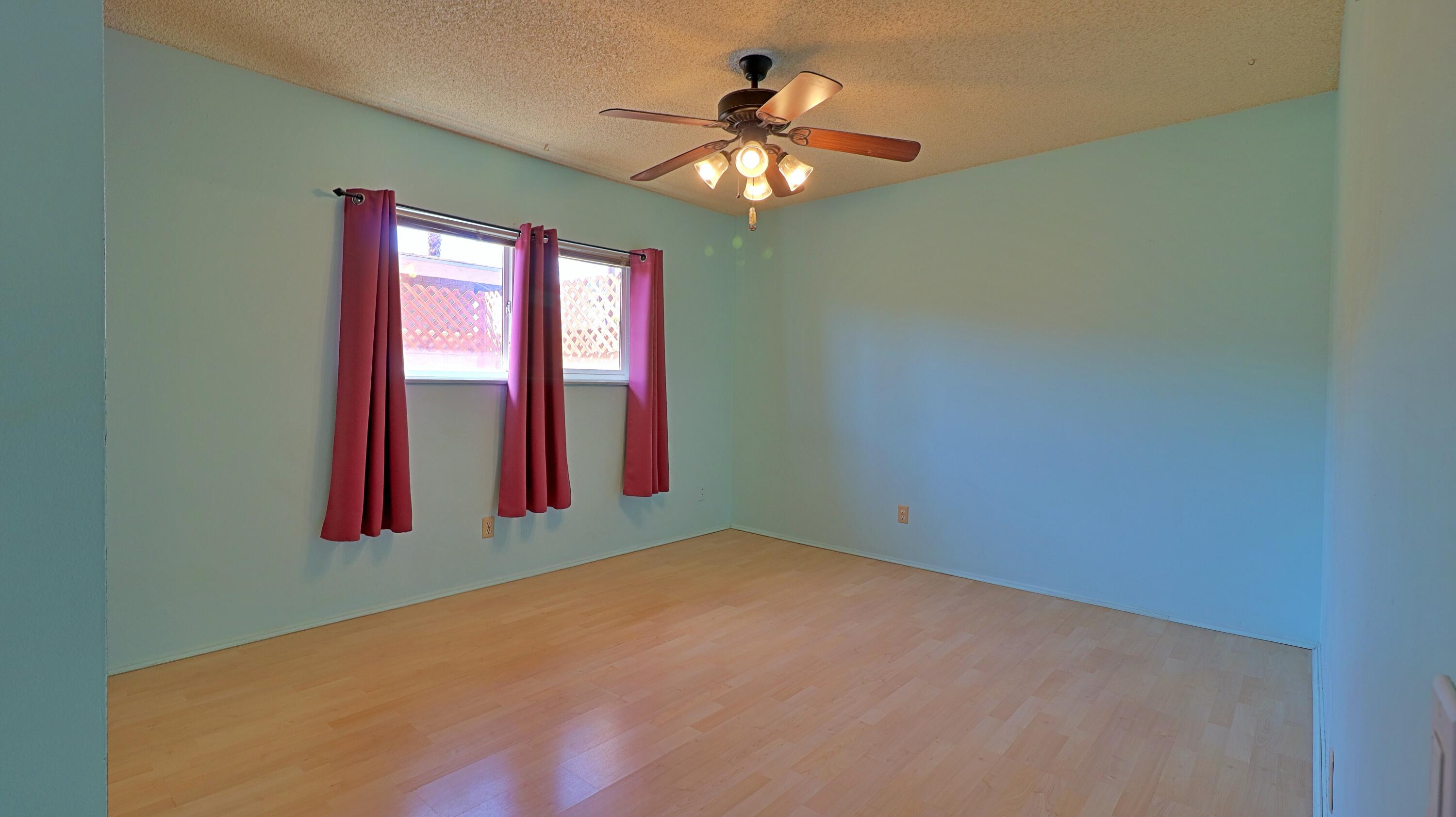 44840 Windsor Drive Indio, CA 92201 - Photo 10 of 26 a view of a livingroom with a chandelier fan and a window