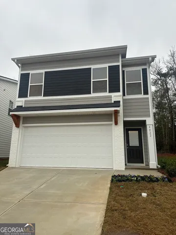 a view of house with garage