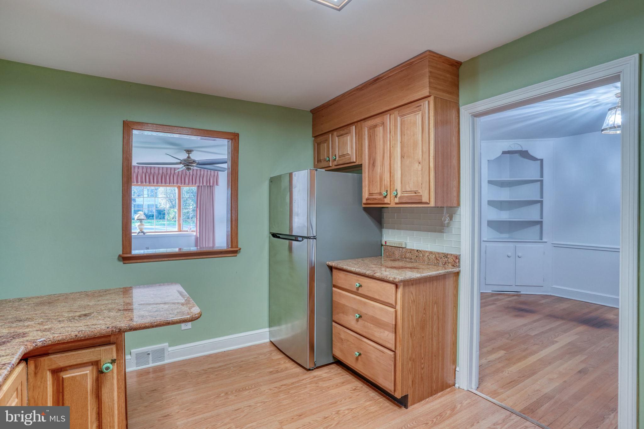 455 East Loockerman Street Dover, DE 19901 - Photo 17 of 55 a kitchen with a cabinets and window