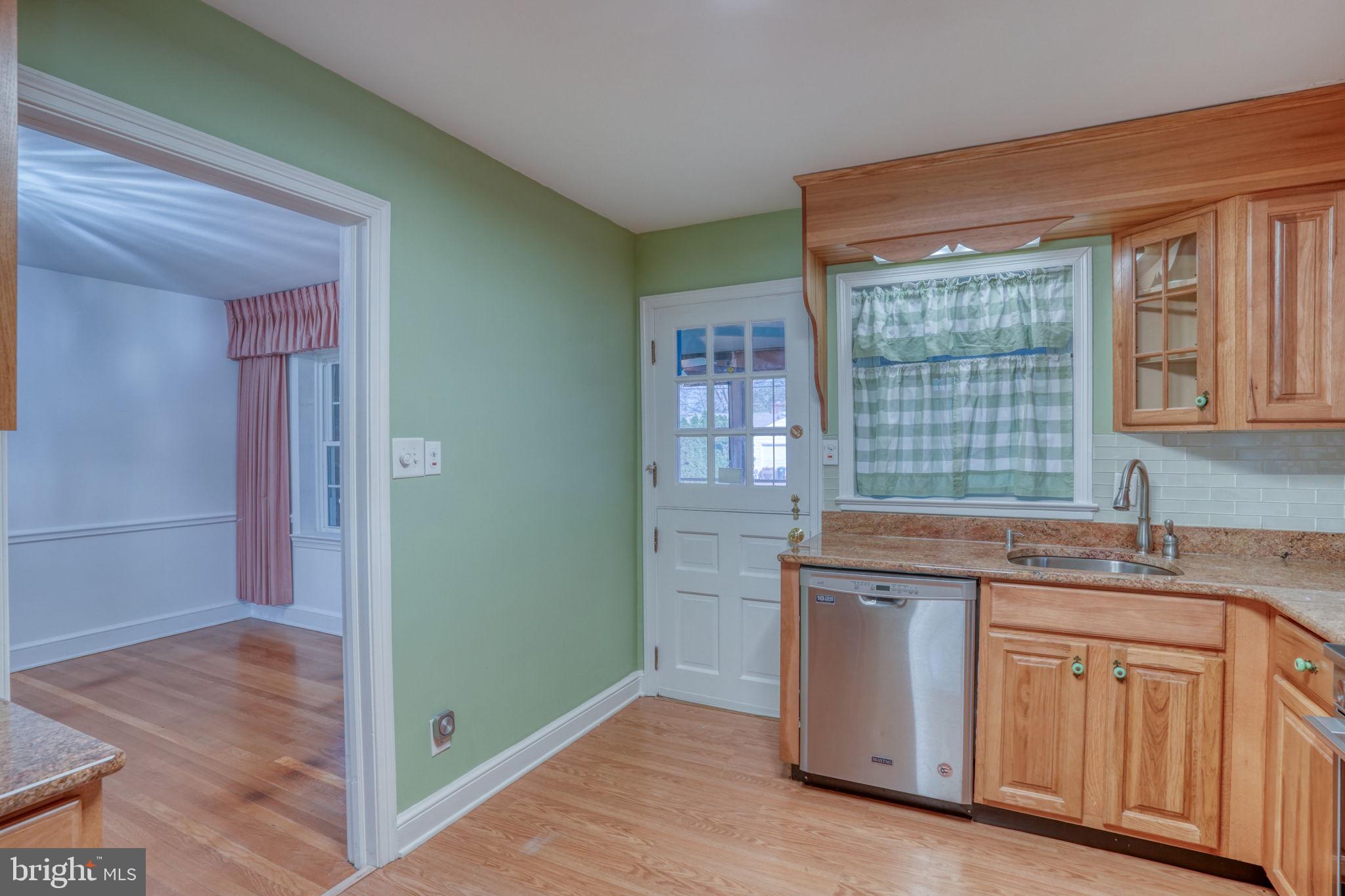 455 East Loockerman Street Dover, DE 19901 - Photo 18 of 55 a kitchen with granite countertop a sink and a stove