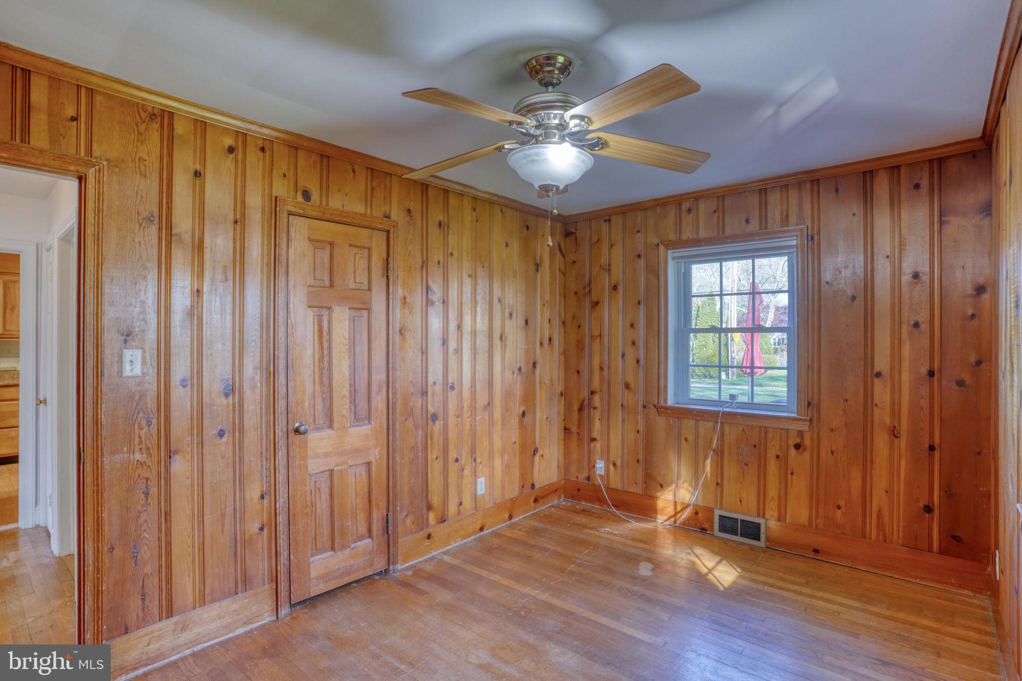 455 East Loockerman Street Dover, DE 19901 - Photo 26 of 55 an empty room with wooden floor fan and windows