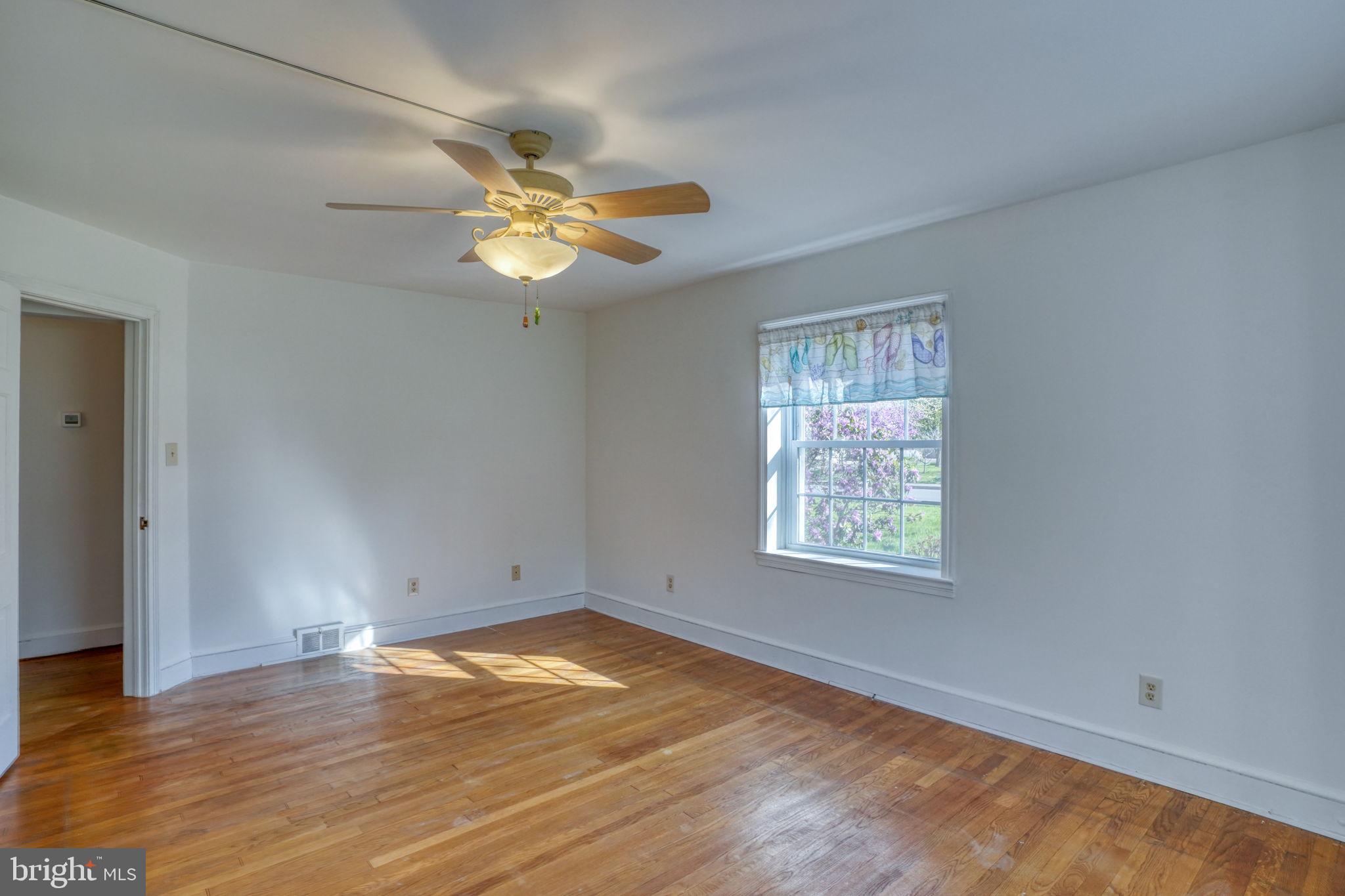 455 East Loockerman Street Dover, DE 19901 - Photo 29 of 55 wooden floor in an empty room with a window