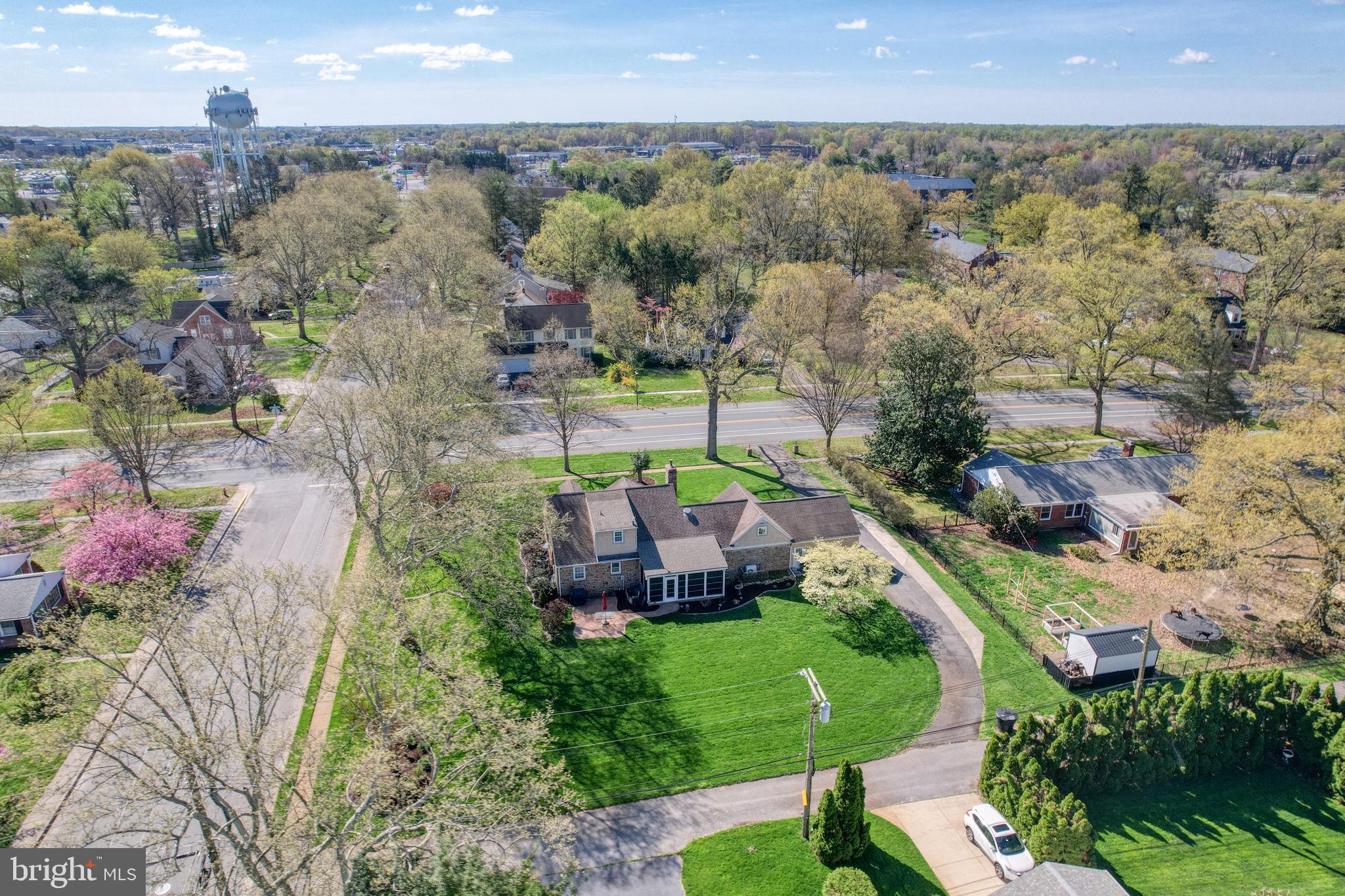 455 East Loockerman Street Dover, DE 19901 - Photo 48 of 55 an aerial view of a house with a yard and lake view