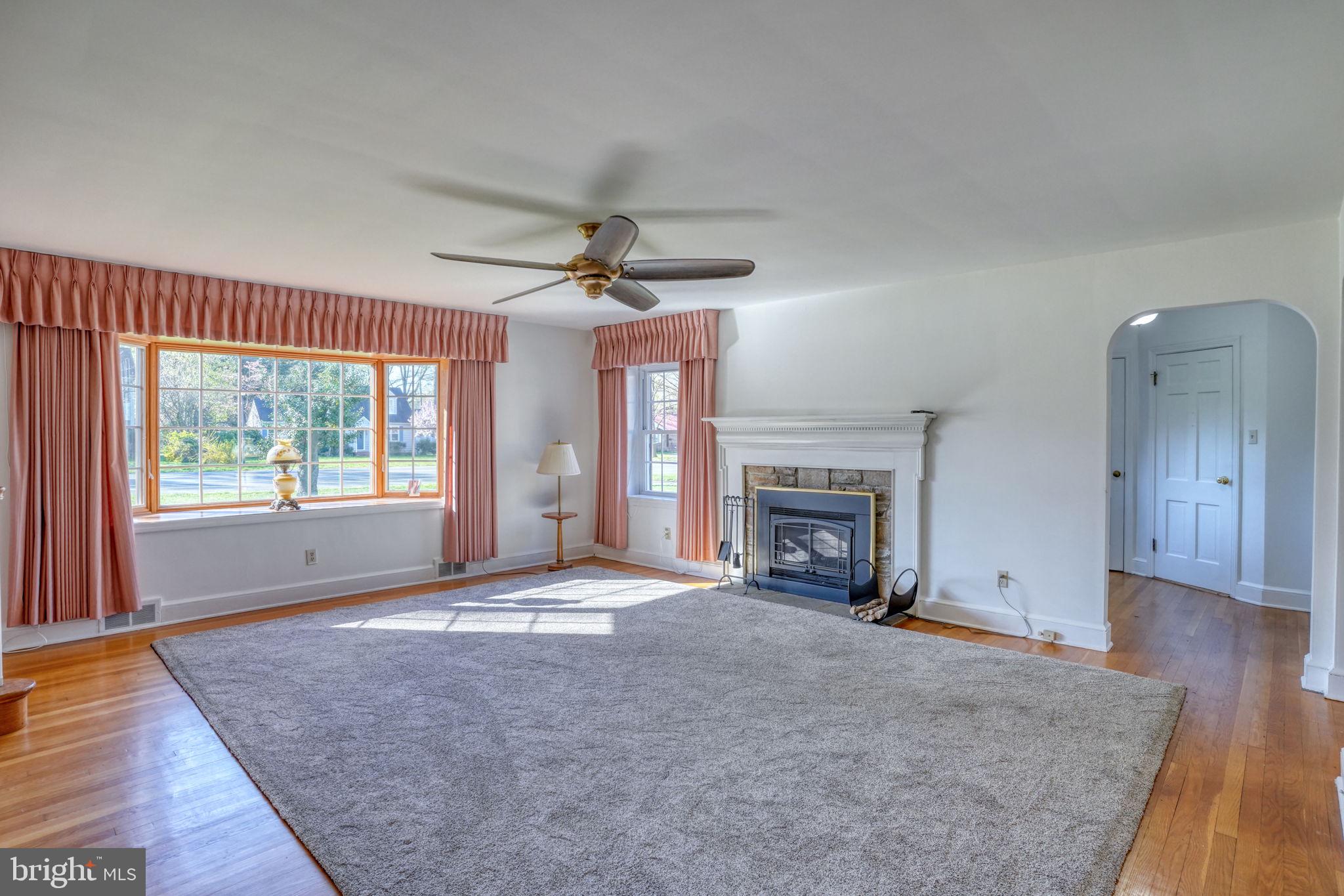 455 East Loockerman Street Dover, DE 19901 - Photo 8 of 55 a view of an empty room with a fireplace and a window