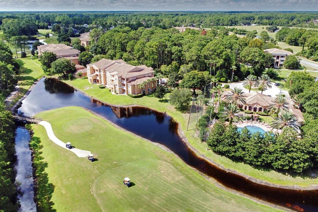 520 Florida Club Boulevard, Unit 104 St. Augustine, FL 32084 - Photo 1 of 20 a view of a swimming pool from a balcony