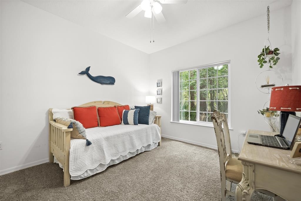 520 Florida Club Boulevard, Unit 104 St. Augustine, FL 32084 - Photo 12 of 20 a living room with furniture and a window