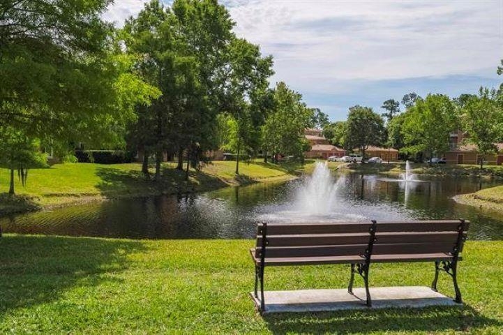 520 Florida Club Boulevard, Unit 104 St. Augustine, FL 32084 - Photo 16 of 20 a view of a lake with houses