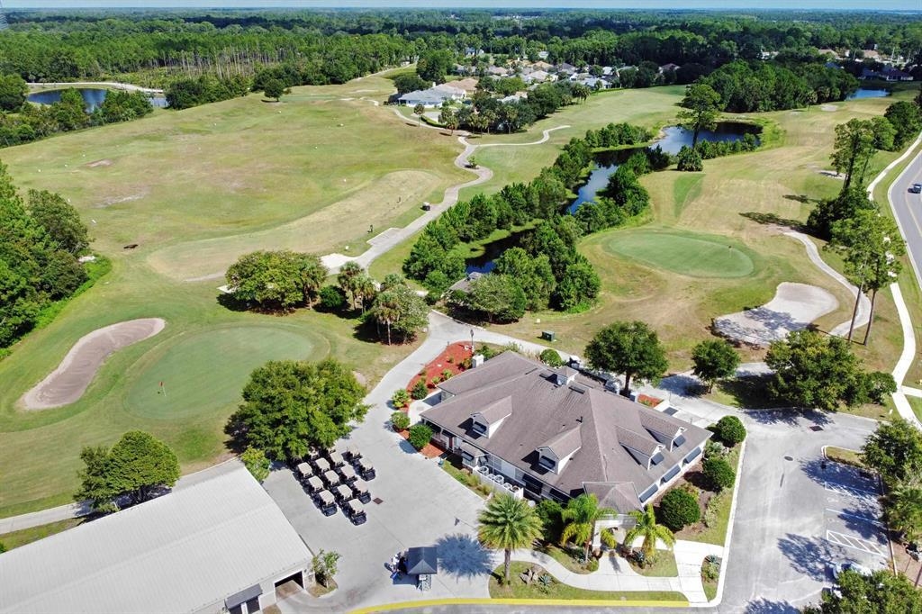 520 Florida Club Boulevard, Unit 104 St. Augustine, FL 32084 - Photo 4 of 20 an aerial view of a house with a garden and lake view