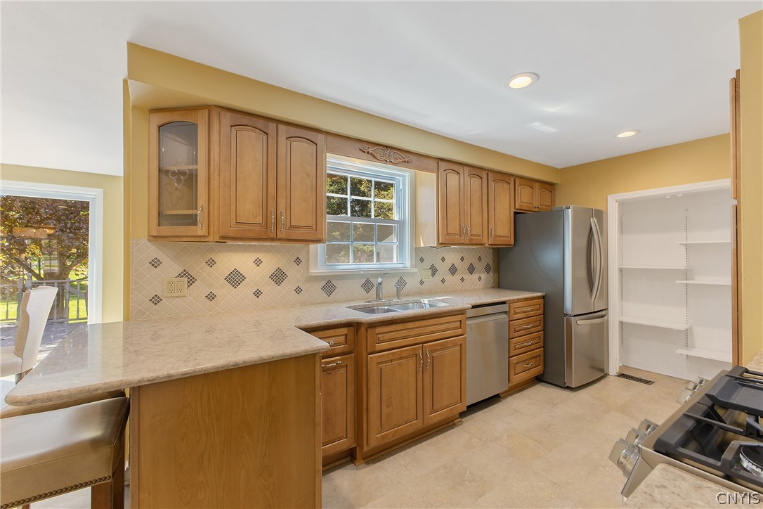 31 Lyndon Road Fayetteville, NY 13066 - Photo 12 of 47 The tile floor is new too !! On the left is a breakfast bar.