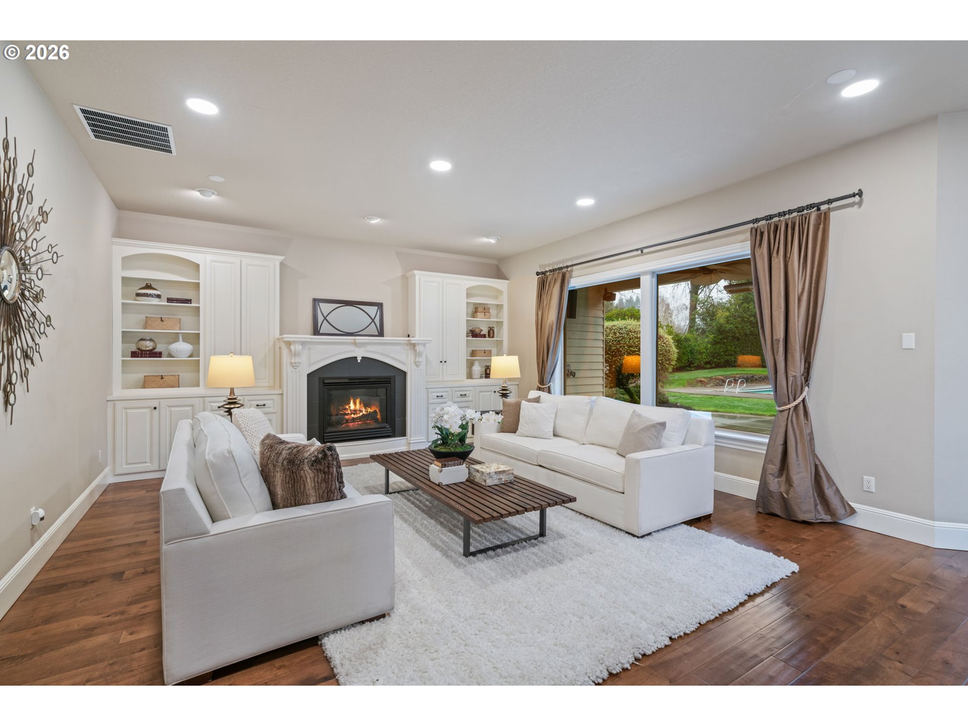 510 Northeast 224th Circle Ridgefield, WA 98642 - Photo 15 of 48 a living room with furniture large window and a fireplace