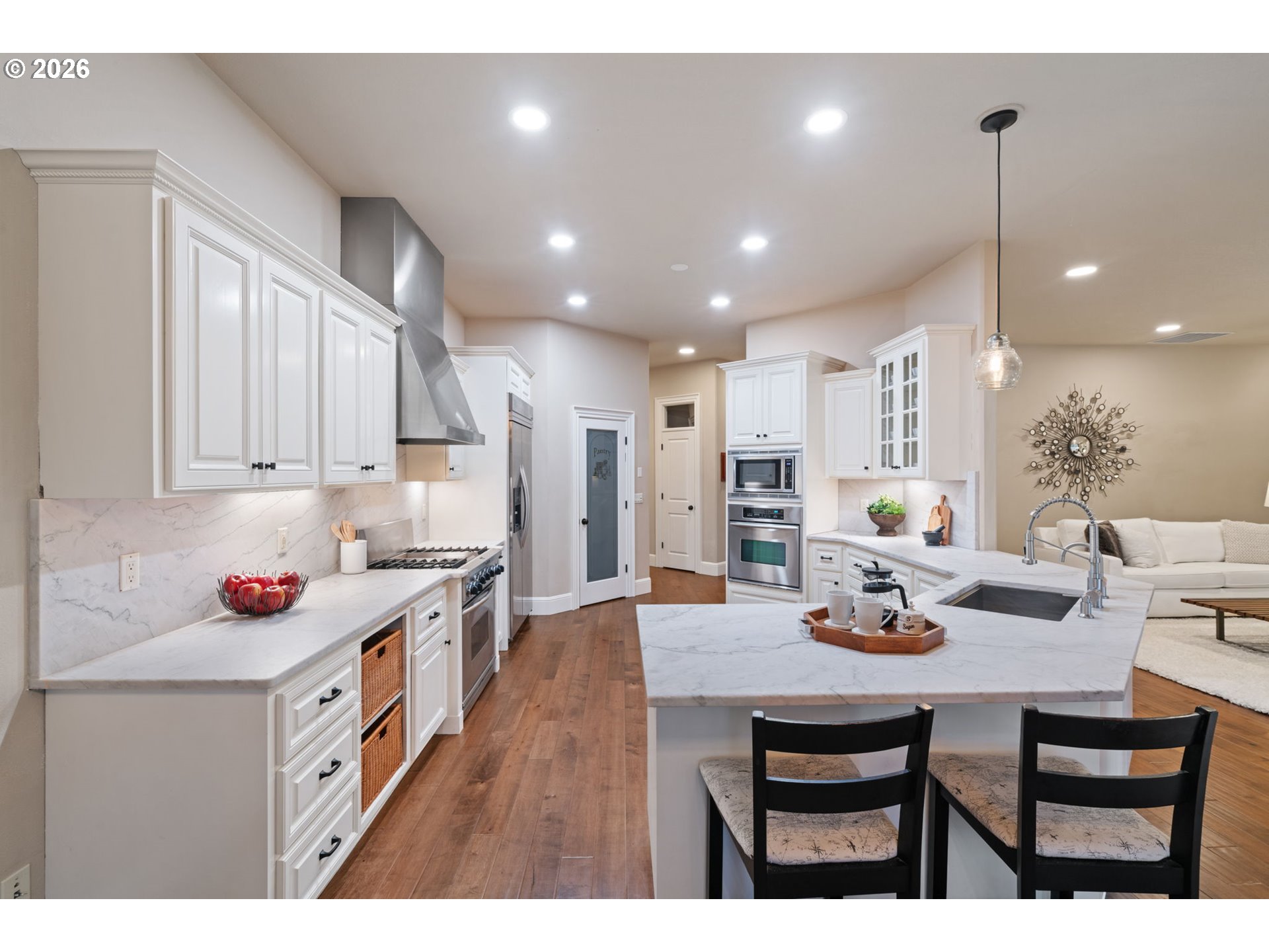 510 Northeast 224th Circle Ridgefield, WA 98642 - Photo 21 of 48 a kitchen with stainless steel appliances a dining table chairs stove and cabinets