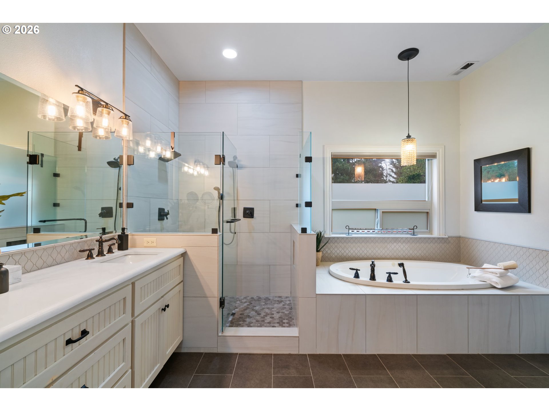 510 Northeast 224th Circle Ridgefield, WA 98642 - Photo 26 of 48 a view of a bathroom with a tub sink and mirror