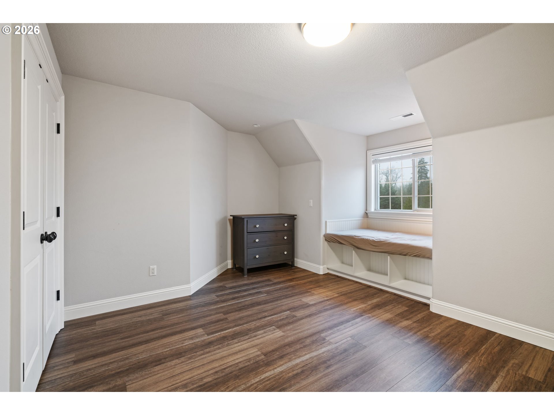 510 Northeast 224th Circle Ridgefield, WA 98642 - Photo 30 of 48 a view of an empty room with wooden floor and a window
