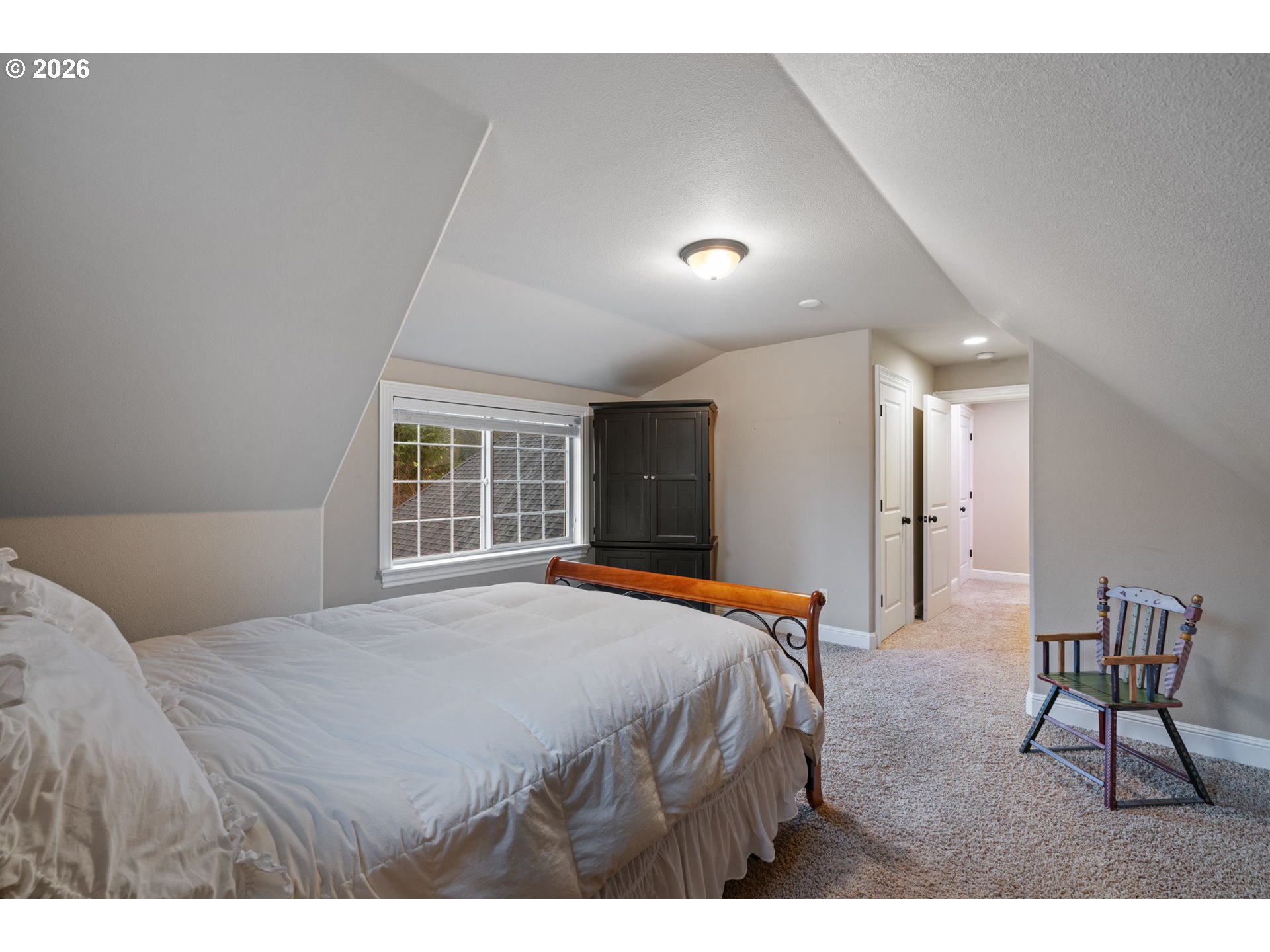 510 Northeast 224th Circle Ridgefield, WA 98642 - Photo 33 of 48 a bedroom with a bed and a large window