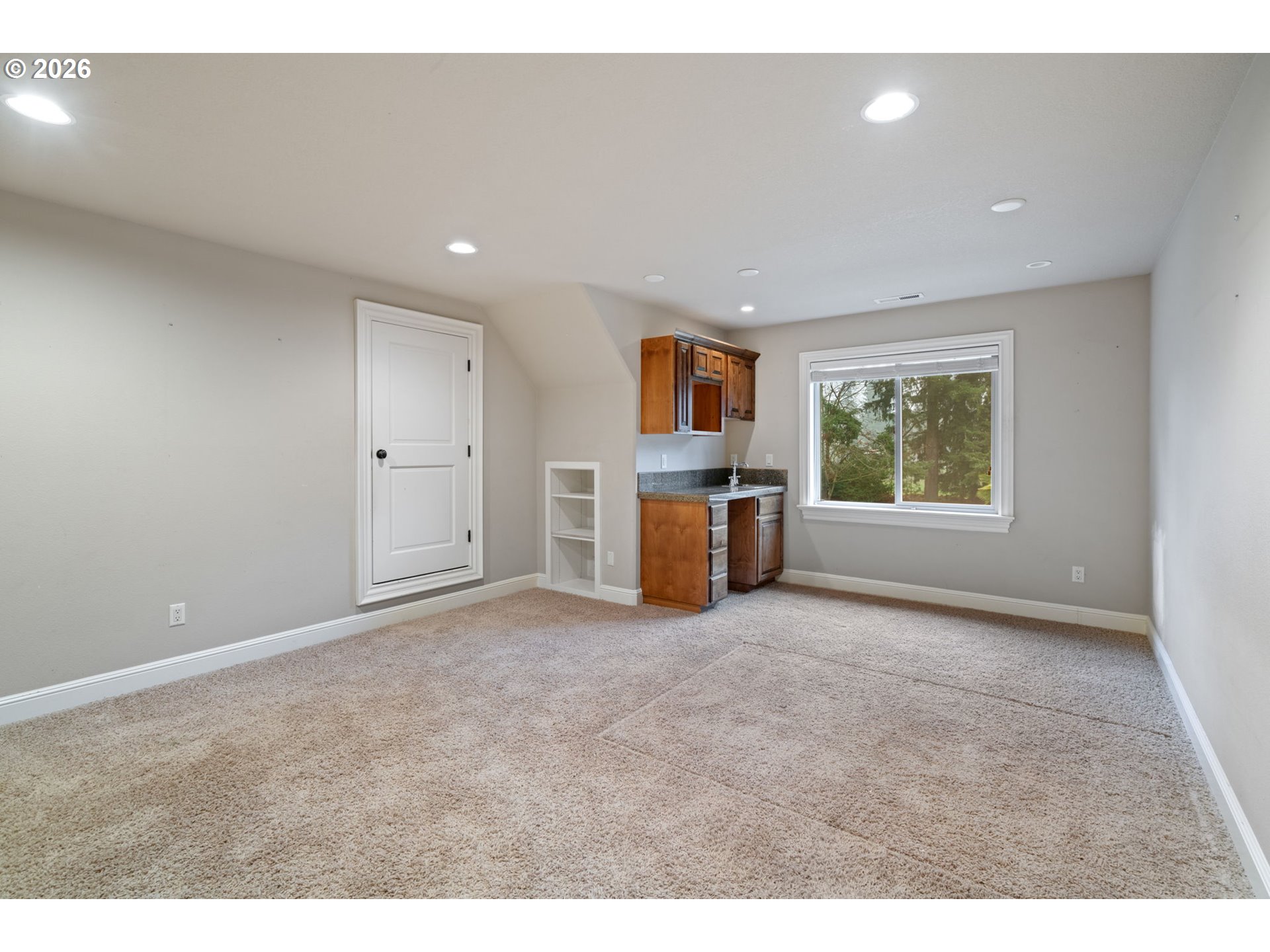 510 Northeast 224th Circle Ridgefield, WA 98642 - Photo 35 of 48 a view of empty room with a window and a kitchen
