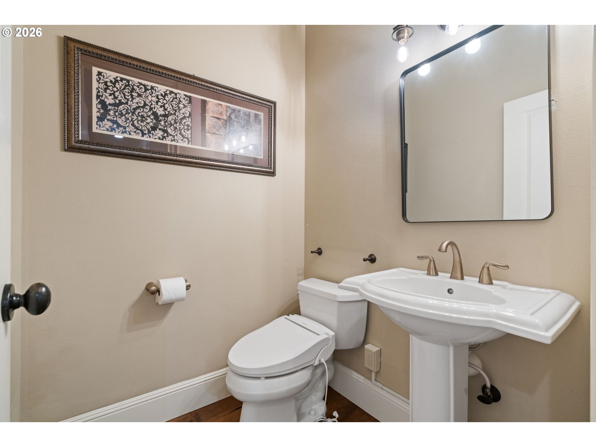 510 Northeast 224th Circle Ridgefield, WA 98642 - Photo 9 of 48 a bathroom with a toilet sink and mirror