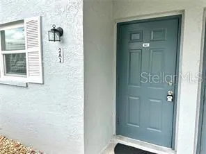 a view of a park with iron fence