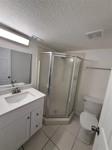 a view of storage and utility room with racks on the wall