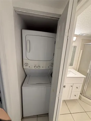 a bathroom with a sink mirror vanity and toilet