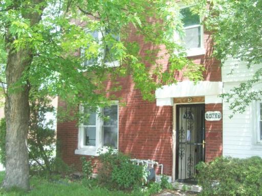 14637 Center Avenue Harvey, IL 60426 - Photo 1 of 1 front view of a house with a tree