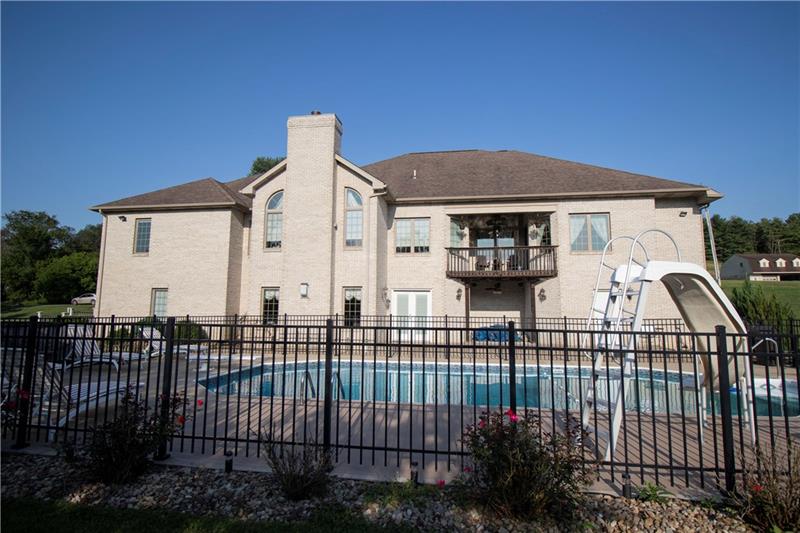 385 Pleasant Valley Road Bulger, PA 15019 - Photo 23 of 25 Exterior Rear of home with view of pool & safety fence!