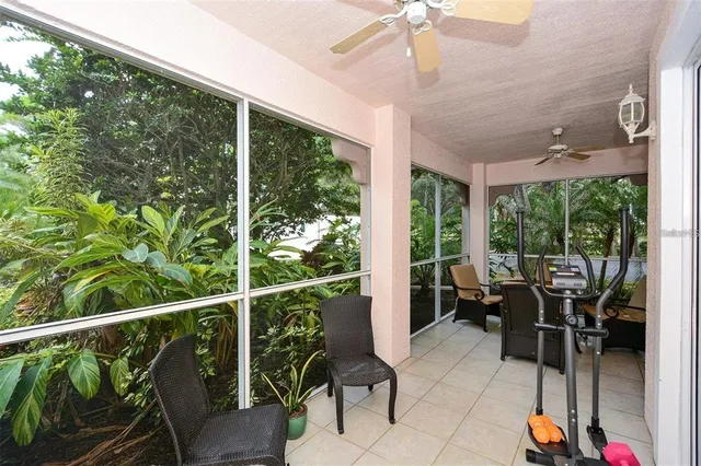 a balcony with furniture and a potted plant