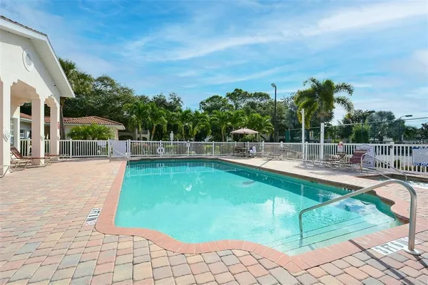 a view of a swimming pool with a lounge chair