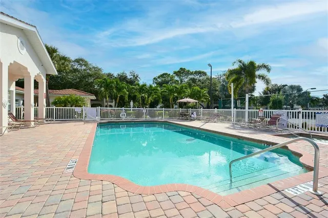a view of a swimming pool with a lounge chair