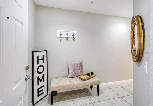 a bedroom with a bed and a mirror