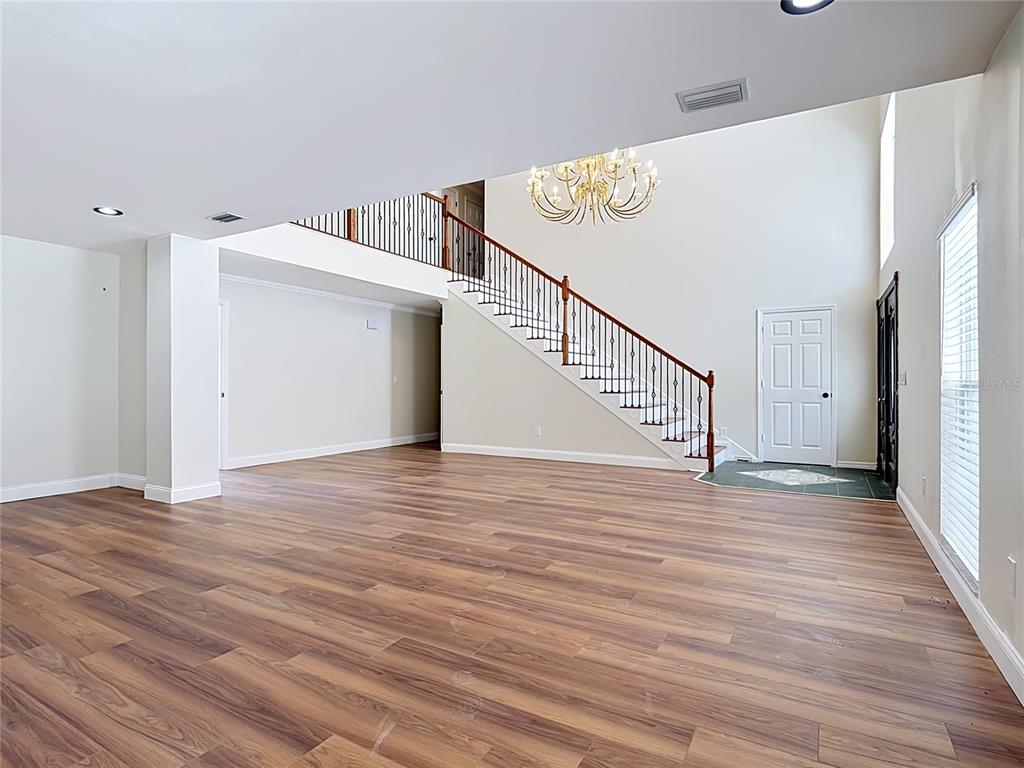 7925 Lake Mabel Loop Road Lake Wales, FL 33898 - Photo 15 of 97 a view of a livingroom with wooden floor