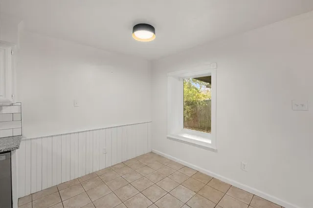 a kitchen with a sink cabinets and window