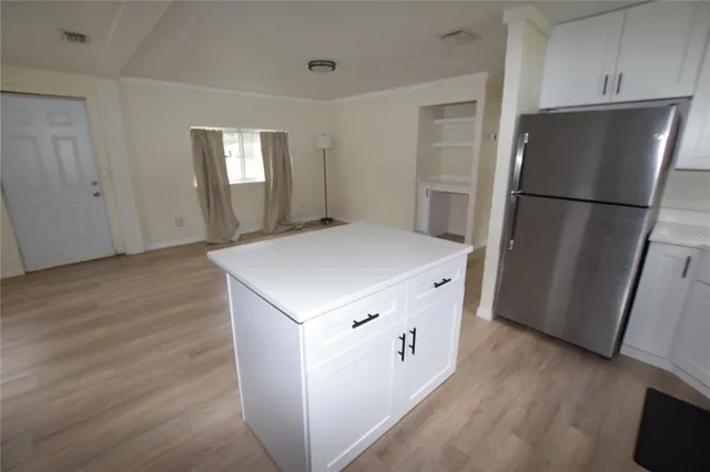 a kitchen with a refrigerator a sink and dishwasher
