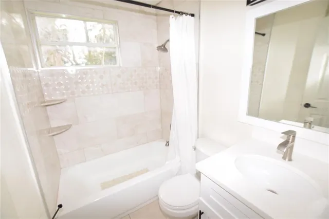 a bathroom with a sink a toilet and a bathtub