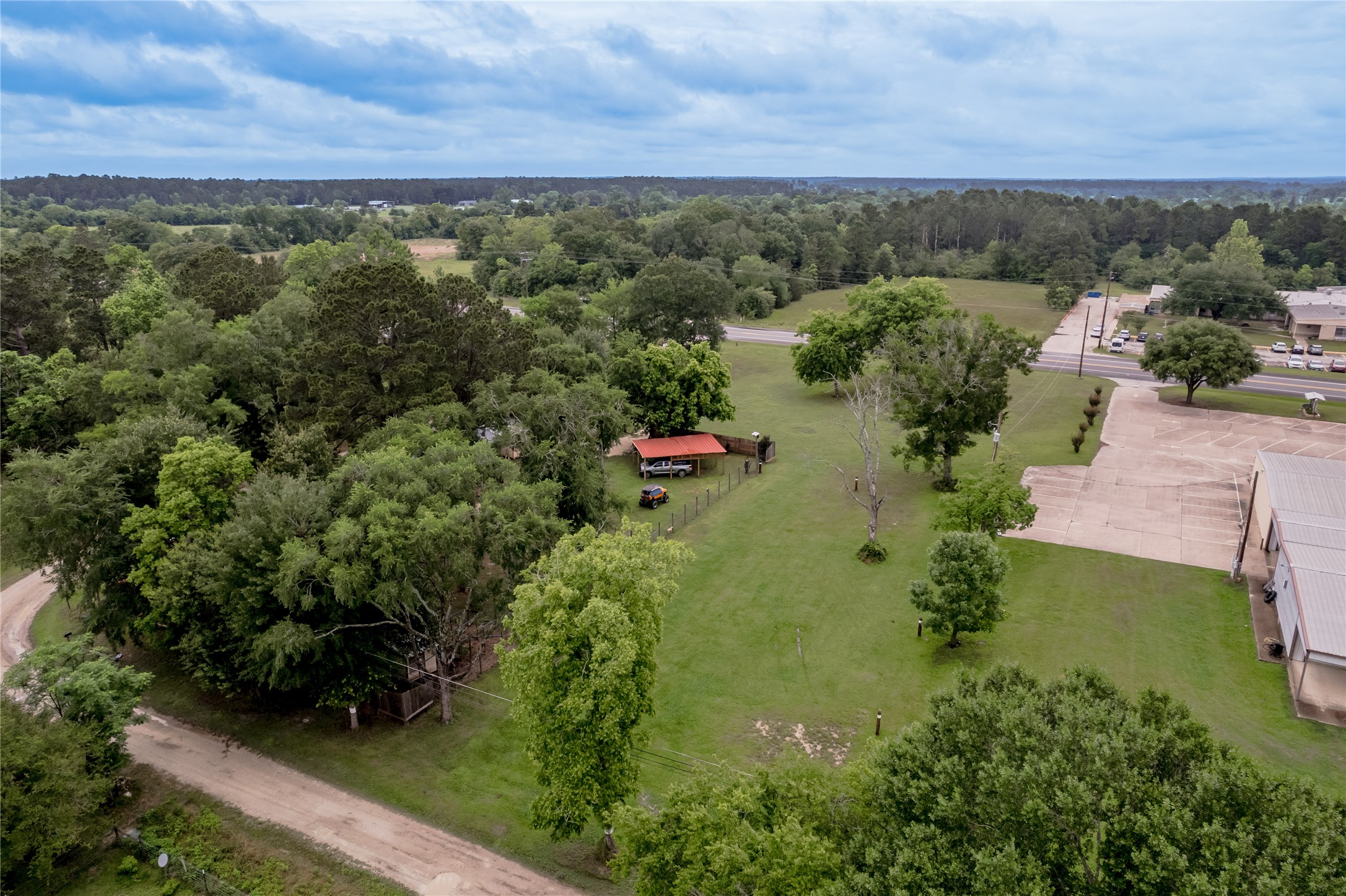 159 Pecan Avenue Groveton, TX 75845 - Photo 27 of 27 an aerial view of a house with a yard