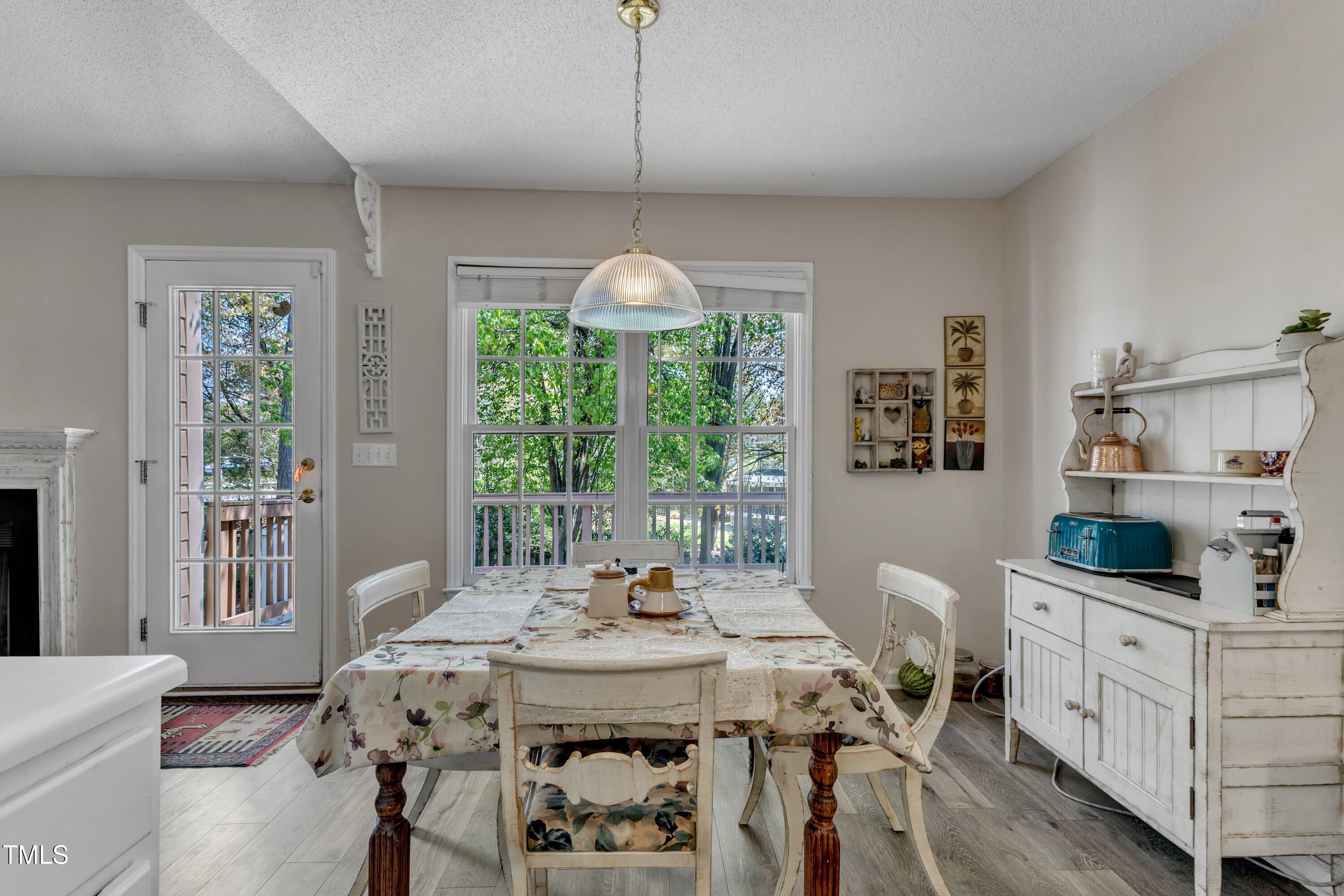 9512 Anson Grove Lane Raleigh, NC 27615 - Photo 11 of 39 a view of a dining room with furniture window and outside view