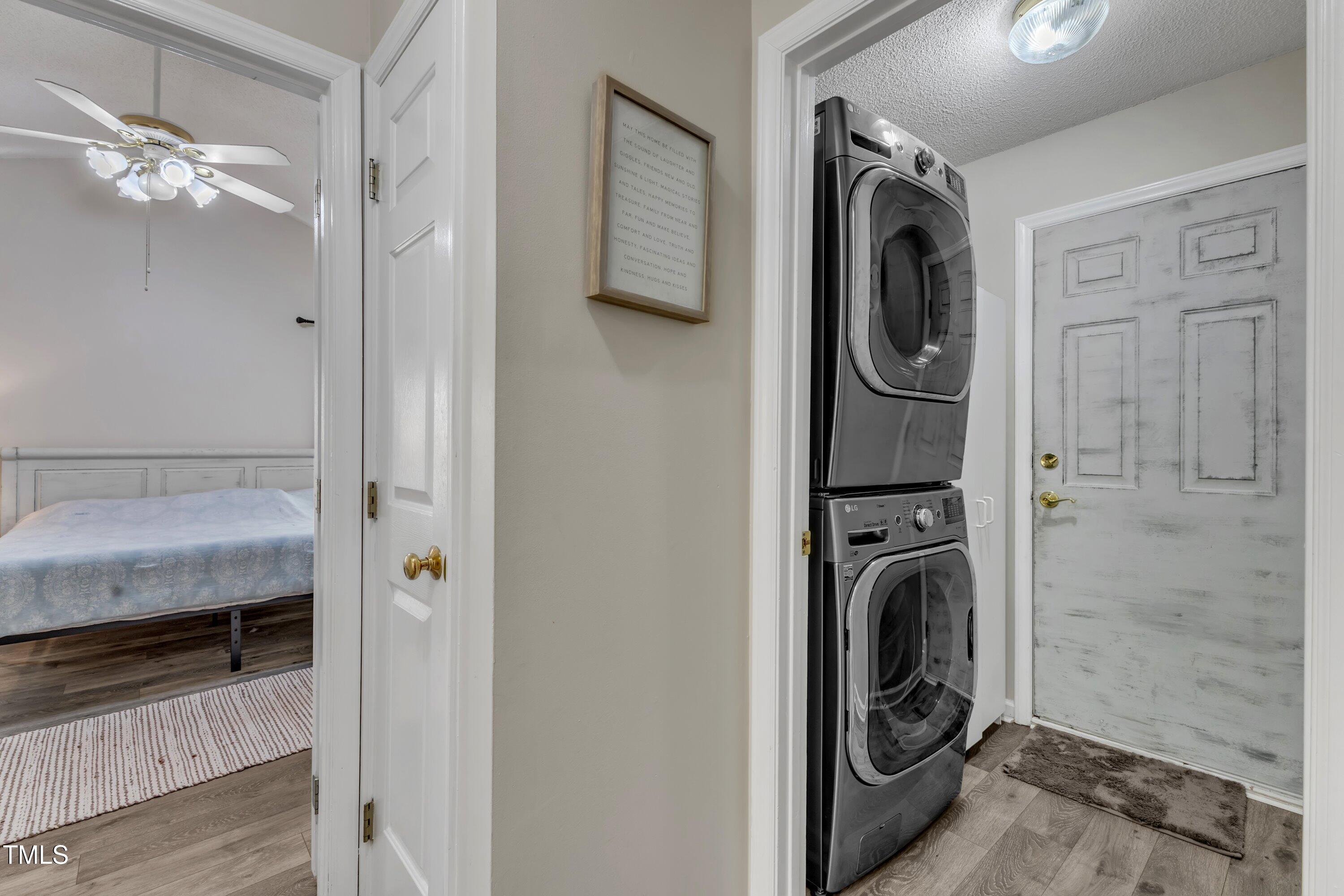 9512 Anson Grove Lane Raleigh, NC 27615 - Photo 30 of 39 a view of a hallway with washer and dryer