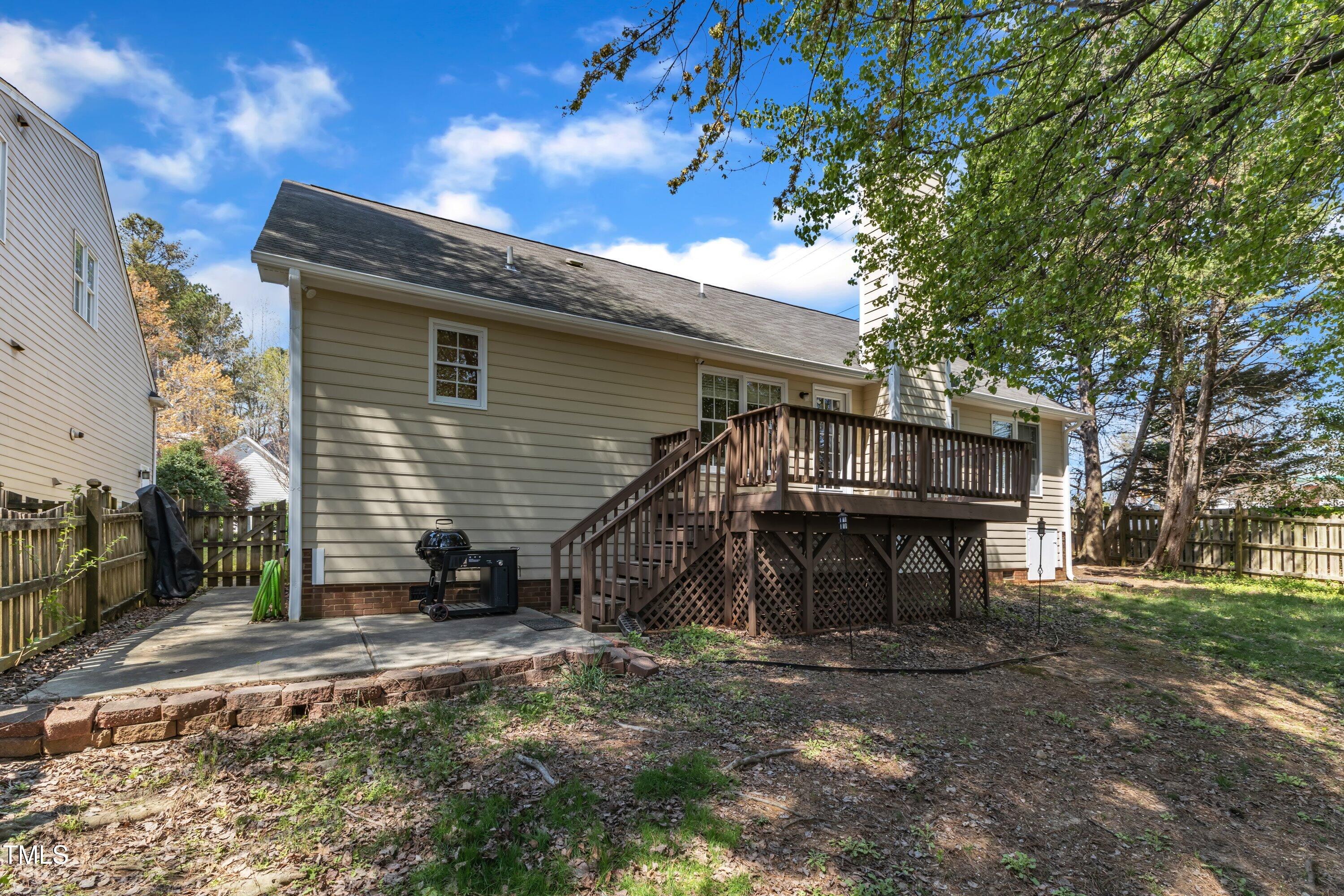 9512 Anson Grove Lane Raleigh, NC 27615 - Photo 33 of 39 a view of a house with a yard