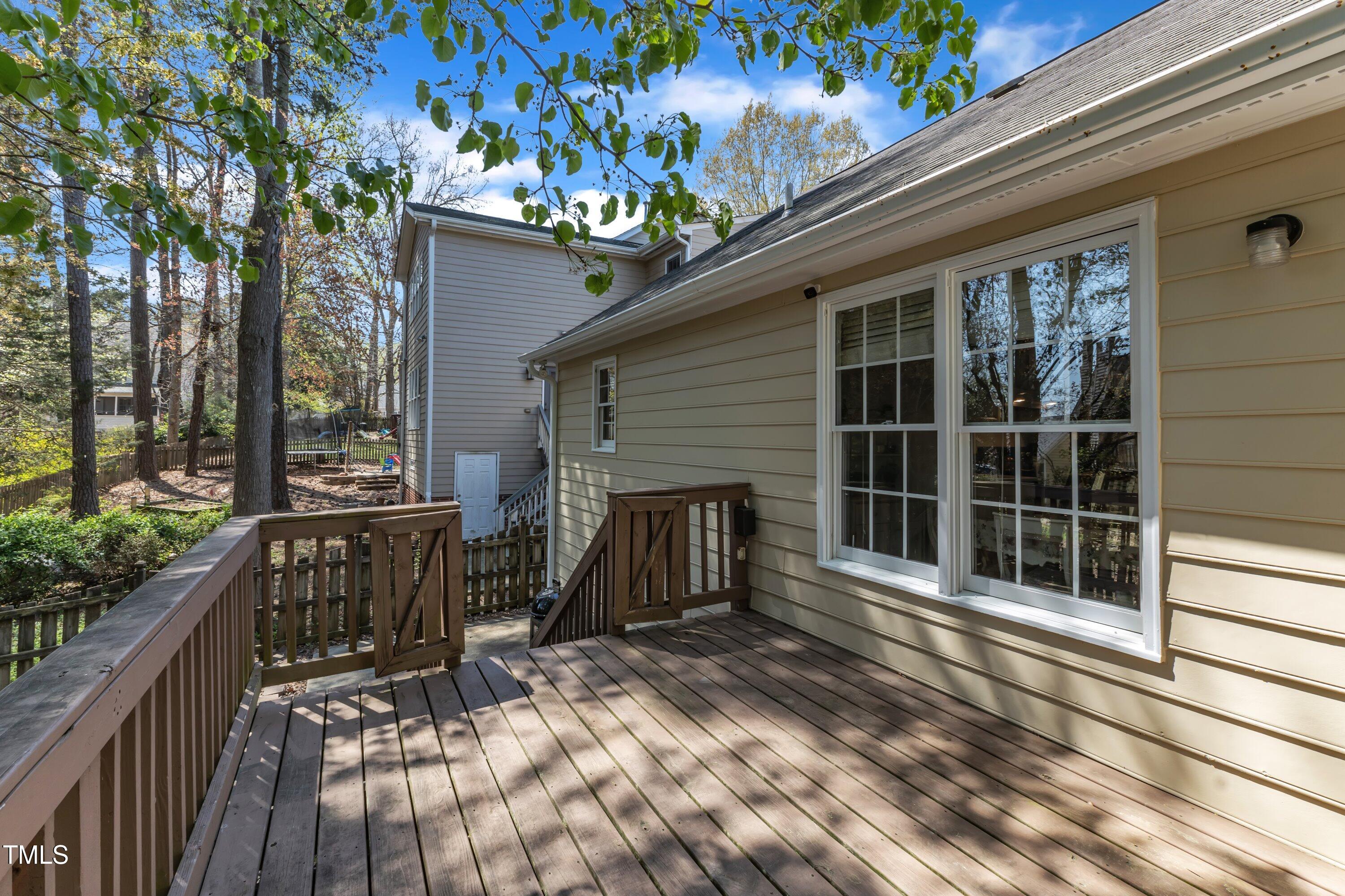 9512 Anson Grove Lane Raleigh, NC 27615 - Photo 35 of 39 a view of a house with backyard and sitting area
