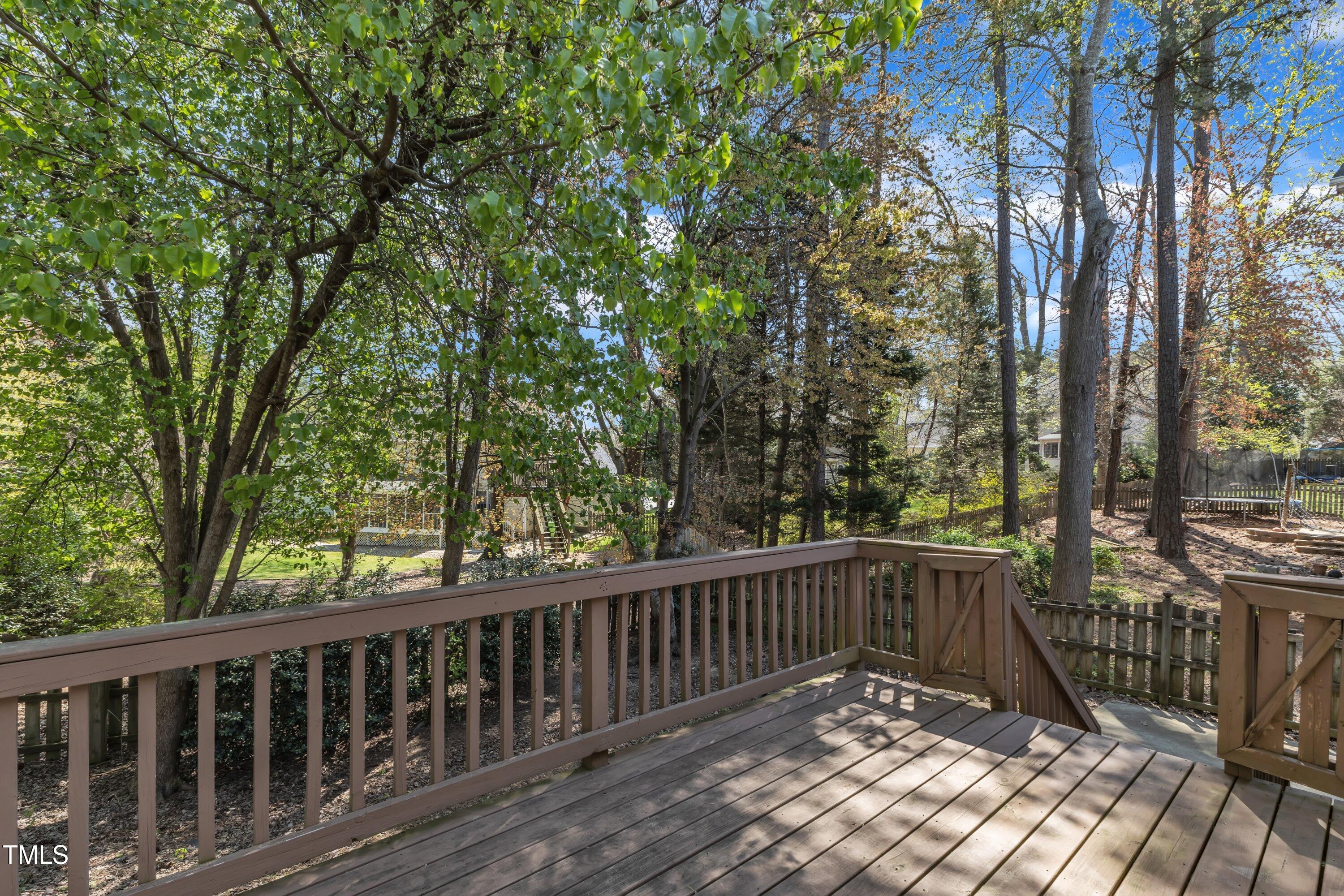 9512 Anson Grove Lane Raleigh, NC 27615 - Photo 36 of 39 a view of balcony with wooden floor and fence
