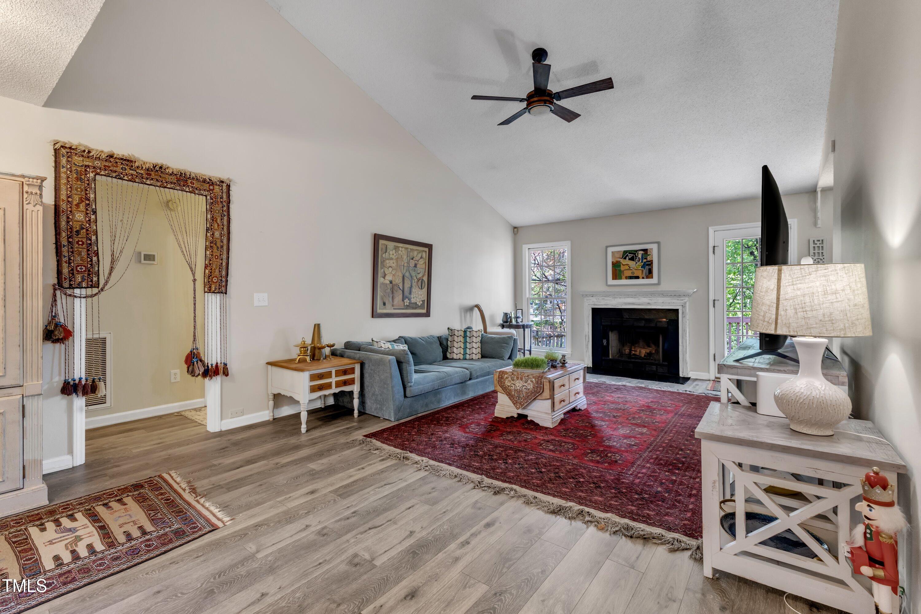 9512 Anson Grove Lane Raleigh, NC 27615 - Photo 6 of 39 a living room with furniture fireplace and a table