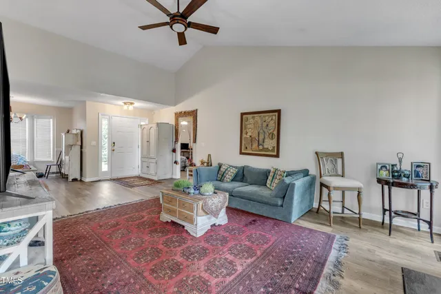 a living room with furniture and a rug