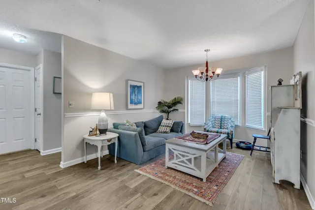 a living room with furniture window and a table