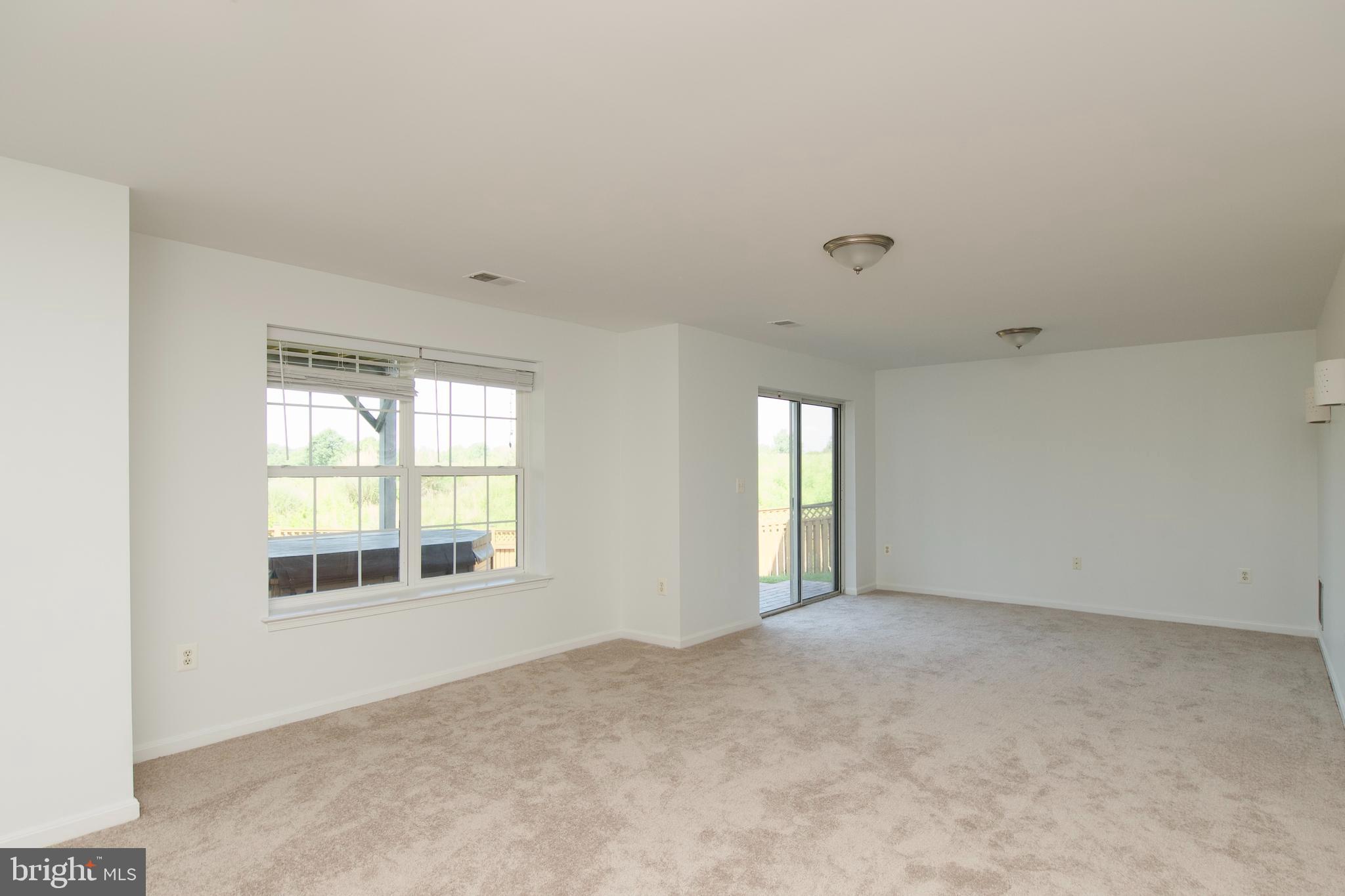 17528 October Glory Loop Dumfries, VA 22026 - Photo 23 of 50 a view of an empty room with a window