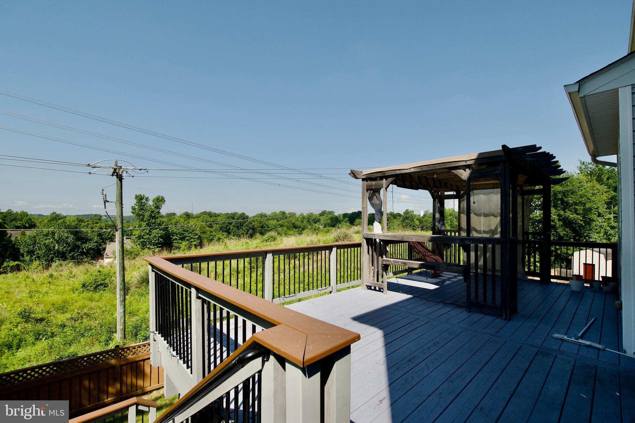 17528 October Glory Loop Dumfries, VA 22026 - Photo 44 of 50 a view of balcony with furniture and wooden deck