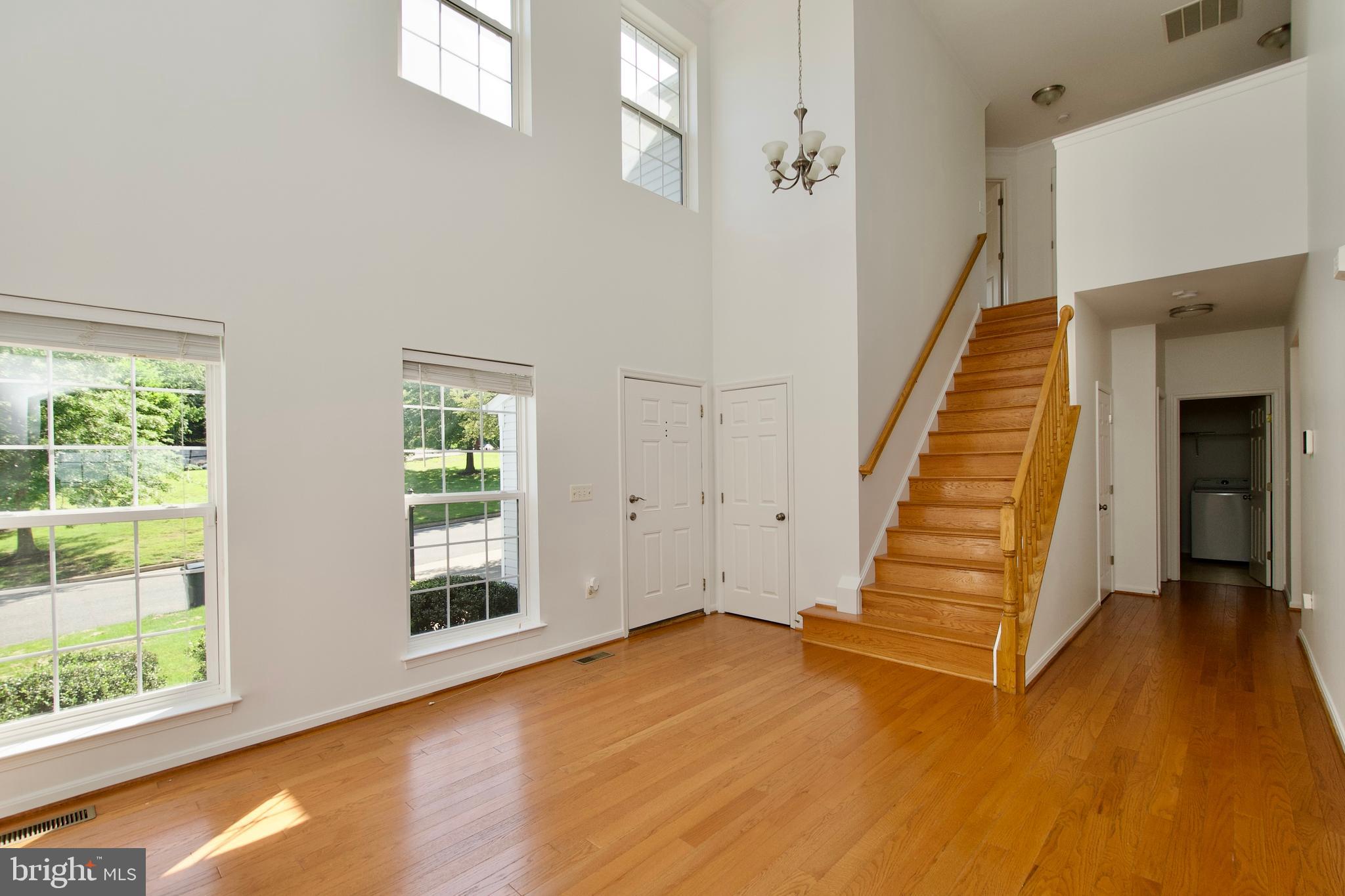 17528 October Glory Loop Dumfries, VA 22026 - Photo 5 of 50 a view of entryway and hall with wooden floor