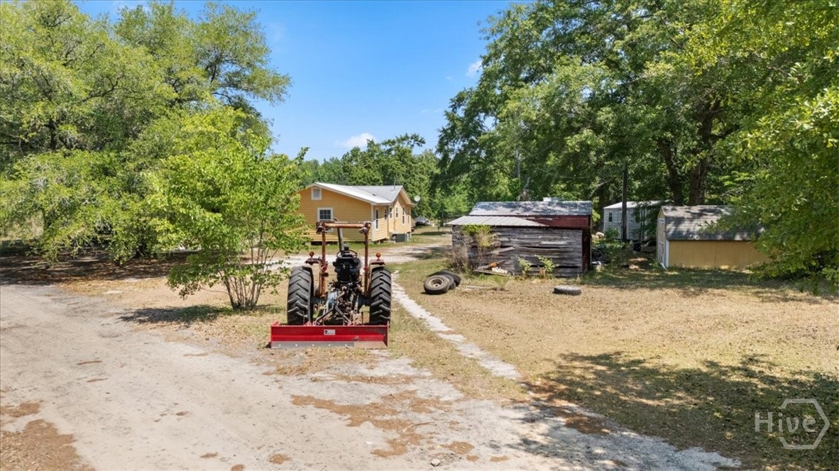 136 Wildwood Church Road Pembroke, GA 31321 - Photo 16 of 29 Primary home plus storage sheds