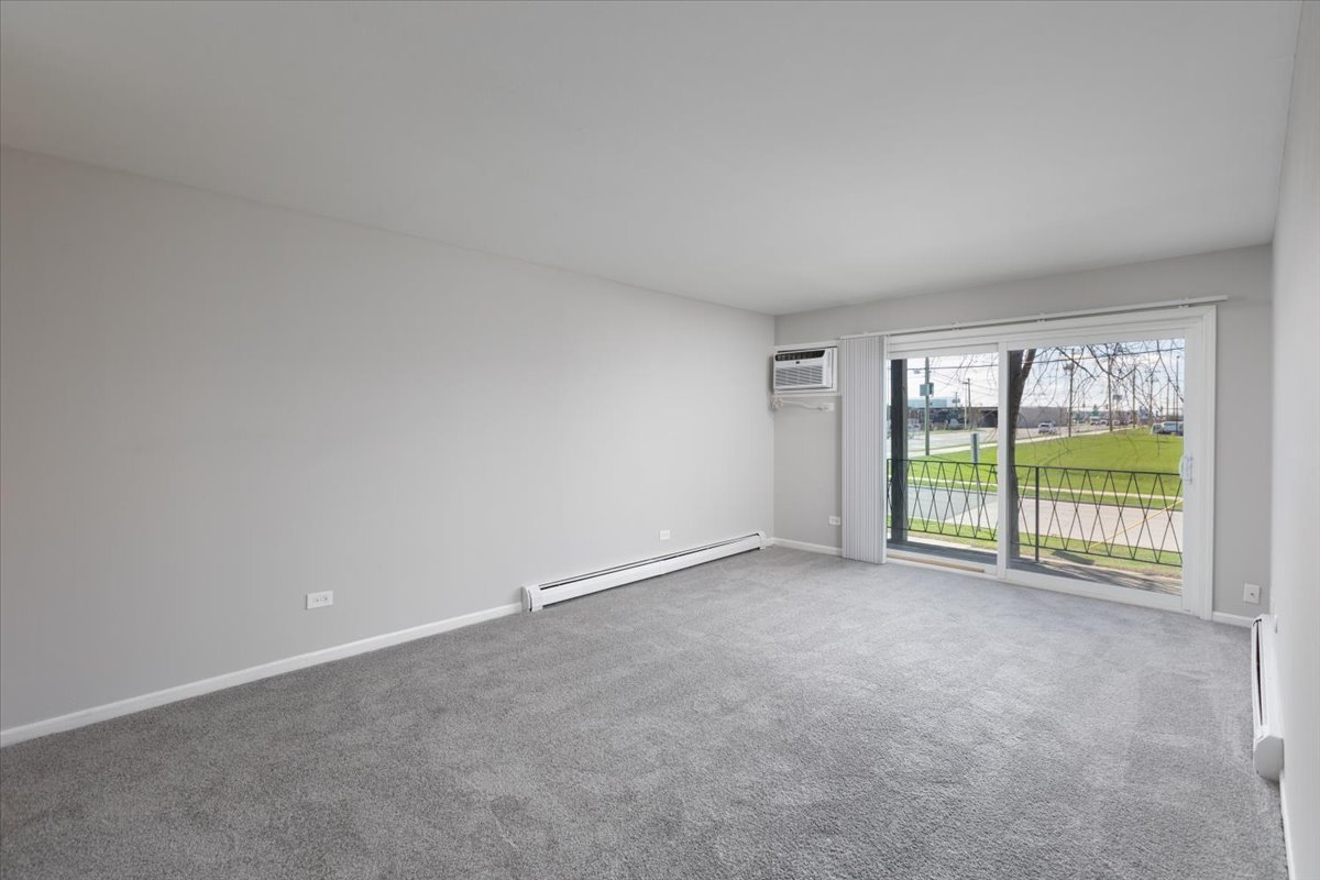 5740 East Avenue, Unit 2D Countryside, IL 60525 - Photo 13 of 24 a view of an empty room with a balcony