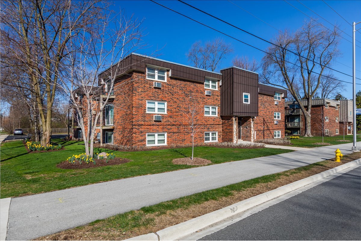 5740 East Avenue, Unit 2D Countryside, IL 60525 - Photo 21 of 24 a front view of a building with garden